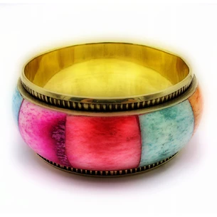 Copper bracelet with colored bone inserts.