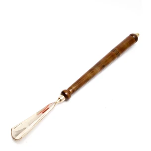 Shoe spoon bronze, wood (41x4.5x2.5 cm)