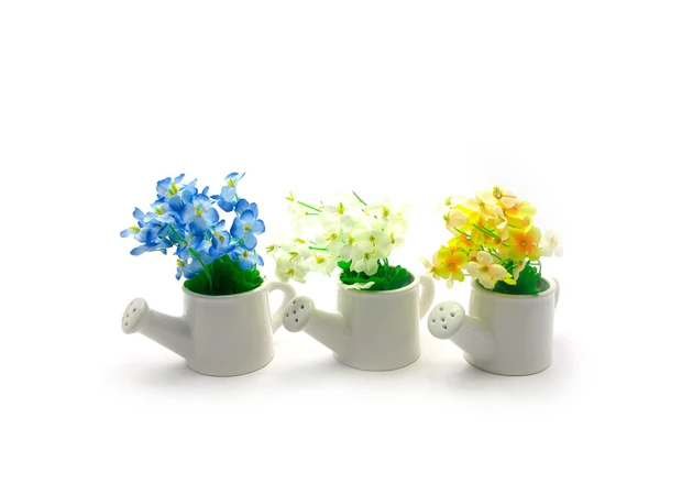 Фото 1 - Flowers in a watering can (15x13.5x7.5 cm)