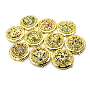 Cosmetic mirror with gold stones (d-7 cm) (in a box + case)