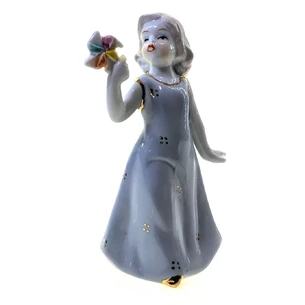 Girl with a porcelain toy (12x7.5x5.5 cm)