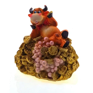 A cow on a pile of money (10x10x9 cm) A