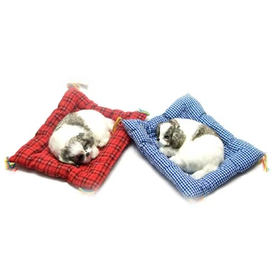 The puppy sleeps on the mat in the car (23x19x4 cm)